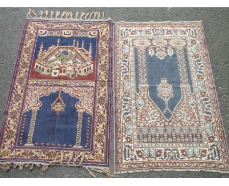 TWO SMALL EASTERN SILK PRAYER MATS. classical scrolling detail, blue mat depicting Mecca, blue mat approx 111 x 62 cm, light 
