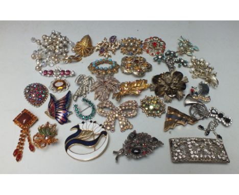 A COLLECTION OF MOSTLY VINTAGE COSTUME BROOCHES, various styles and periods, (Approx. 30)Condition Report:Condition commensur
