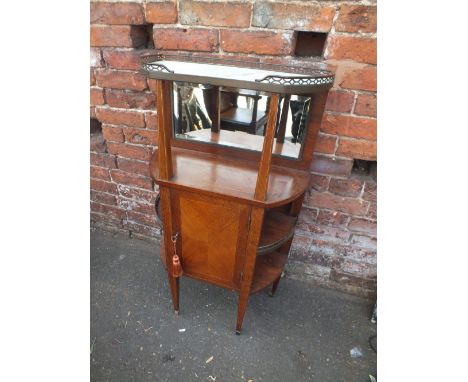 A SMALL ANTIQUE FRENCH ETAGERE, the shaped marble top with brass gallery rail, above an open shelf with bevelled mirror, cent
