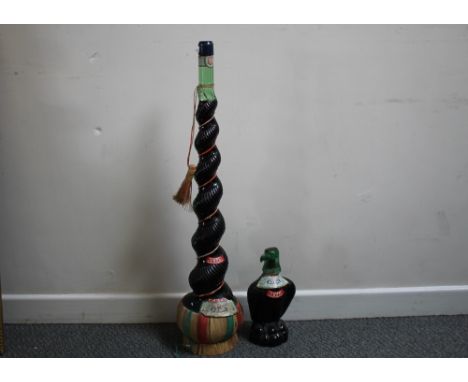 A LARGE AND UNUSUAL SPIRAL GLASS BOTTLING OF BESS CHIANTI 1975 TOGETHER WITH AN EAGLE DECANTER EXAMPLE 1977 VINTAGE (2)