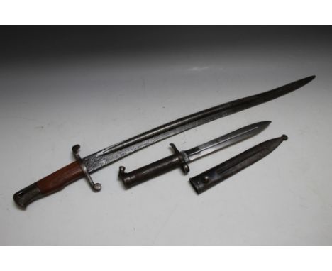 TWO 20TH CENTURY BAYONETS, one with metal scabbard, British and Swedish, shortest  L 35 cm, longest L 71 cm