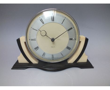 A SMITHS ART DECO CREAM AND BLACK BAKELITE MANTLE CLOCK, the circular dial with Roman numerals, 30 hour manual wind movement,