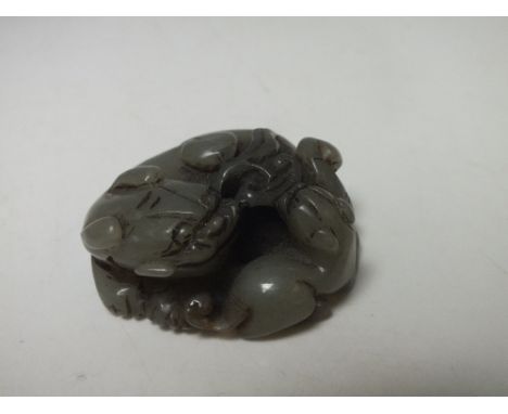 A 20TH CENTURY JADE CARVING OF A LION, H 2 cm, L 5 cm