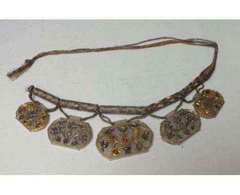 AN UNUSUAL ORIENTAL MUTTON FAT JADE PANEL AND GEMSET HEADDRESS / NECKLACE IN NEED OF REPAIR, comprising five graduating panel