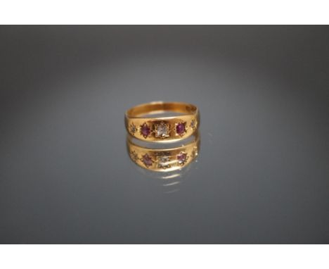 A HALLMARKED 18 CARAT RUBY AND DIAMOND RING,  ring size P