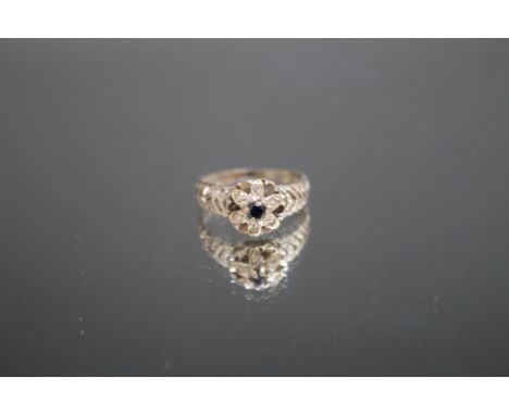 A SAPPHIRE AND DIAMOND DRESS RING, probably re-sized and rhodium plated, ring size O 1/2