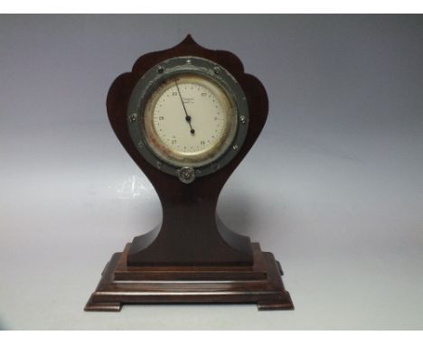 AN EARLY 20TH CENTURY AERONAUTICAL COCKPIT BAROMETER, displayed in a mahogany Art Nouveau style wooden mount, overall H 27 cm