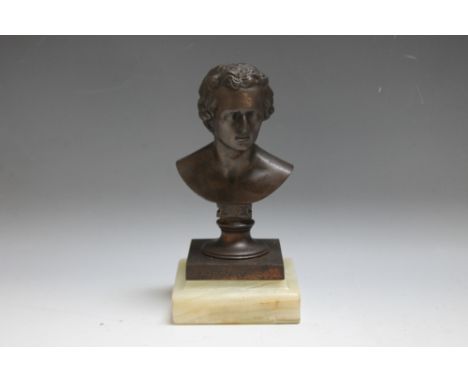 A BRONZE TYPE BUST OF A GENTLEMAN, on an onyx type base, H 18.5 cm