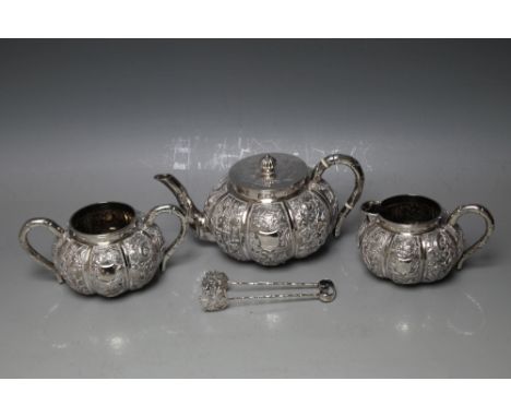 AN ORIENTAL WHITE METAL THREE PIECE TEA SERVICE, marks to base, together with a pair of tongs, approx combined weight 805g (4