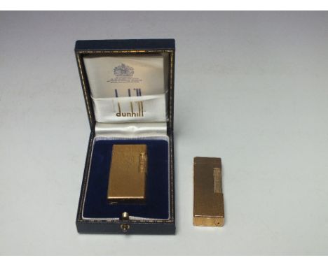A CASED GOLD PLATED VINTAGE DUNHILL 70 LIGHTER, with textured bark effect finish to the case, H 6 cm, together with another D