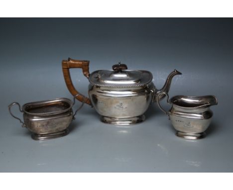 A HALLMARKED THREE PIECE TEA SERVICE BY ADIE BROS - BIRMINGHAM 1925, having an crest and Latin motto 'Virtue Fortunam Domare'