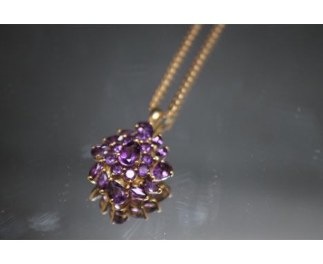 A HALLMARKED 9 CARAT GOLD AMETHYST CLUSTER PENDANT, on a 9 carat gold flat link chain, approx weight 7g, H 3 cm