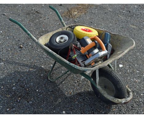 Wheel barrow plus some tools inside. Please note this lot has the standard Ewbank's standard buyers premium payable on top of