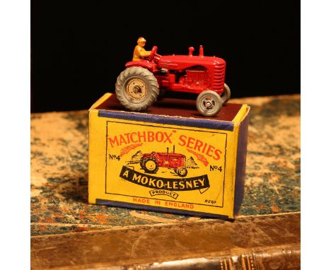 Matchbox '1-75' series diecast model 4a Massey Harris tractor, red body with rear mudguards, seated tan driver figure, metal 