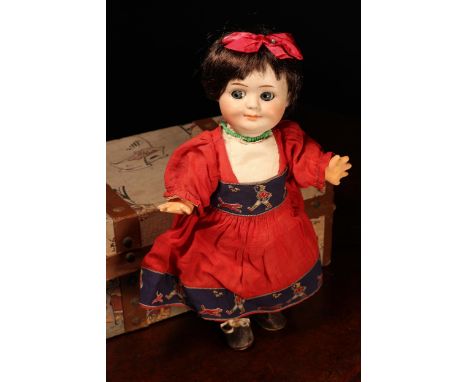 A Gebrüder Heubach (Germany) bisque head novelty Googly-eyed doll, the bisque head with painted features including feathered 
