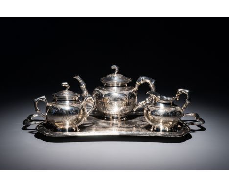 A Chinese silver tea service on tray, Republic, 1st half 20th C. H.: 15 cm - L.: 23 cm (the teapot)H.: 12 cm - L.: 16 cm (the