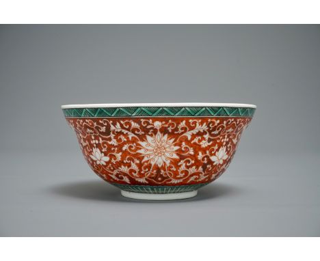 A Chinese coral-ground lotus scroll bowl, Jiaqing mark, 19/20th C. H.: 8 cm - Dia.: 17,5 cm We have more lots available exclu