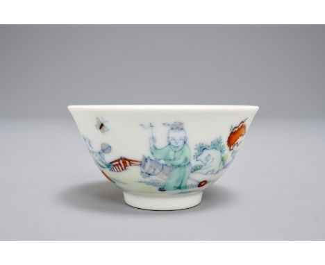 A Chinese doucai tea bowl with playing boys, Yongzheng mark, 19/20th C. H.: 3 cm - Dia.: 6,5 cm We have more lots available e