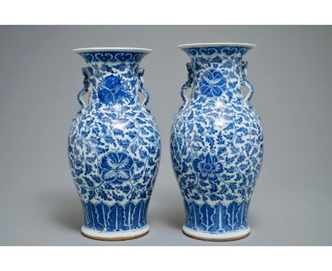 A pair of Chinese blue and white flower scroll vases, 19th C. H.: 45 cm We have more lots available exclusively on our websit