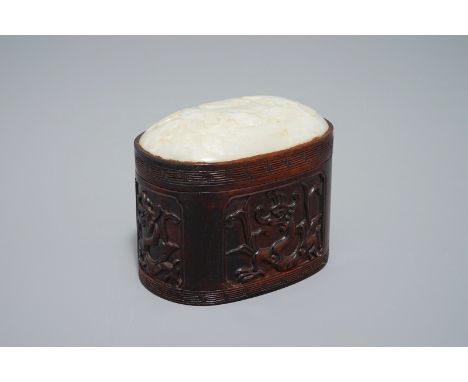A Chinese jade top carved mahogany box, 19/20th C. Dim.: 12,5 x 8,5 x 10,5 cm We have more lots available exclusively on our 