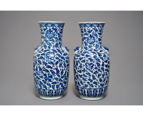 A pair of Chinese blue and white flower scroll vases, 19th C. H.: 45,5 cm We have more lots available exclusively on our webs