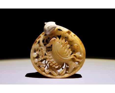 A Chinese reticulated mottled jade phoenix plaque, Ming or earlier Dim.: 7 x 6,7 cm  Provenance: A Belgian private collection