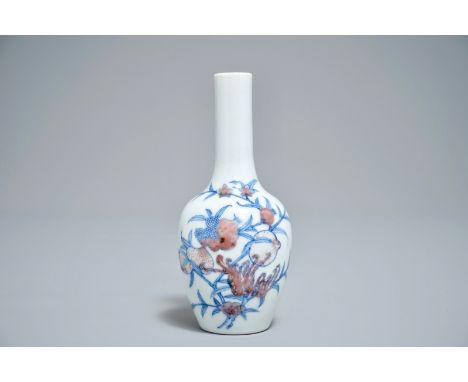 A Chinese blue and underglaze red 'sanduo' vase, Kangxi mark, 19/20th C. H.: 13,5 cm We have more lots available exclusively 