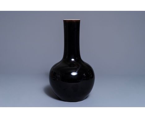 A Chinese mirror-black-glazed bottle vase, Kangxi mark, 19th C. H.: 39,5 cm    We have more lots available exclusively on our