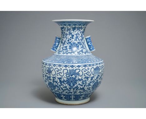 A Chinese blue and white lotus scroll hu vase, 19th C. H.: 49 cm We have more lots available exclusively on our website www.r