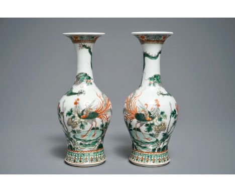 A pair of Chinese famille verte 'dragon and phoenix' vases, Kangxi mark, 19th C. H.: 25 cm We have more lots available exclus