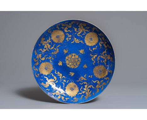 A Chinese powder blue and gilt lotus scroll plate, Kangxi Dia.: 27,5 cm We have more lots available exclusively on our websit