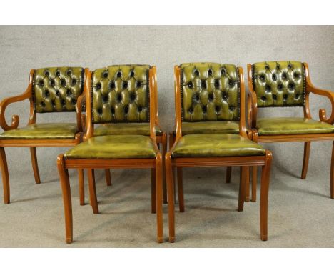 A set of six Yew wood Regency style button/quilted backed dining chairs comprised of four singles and two open arm carvers ra