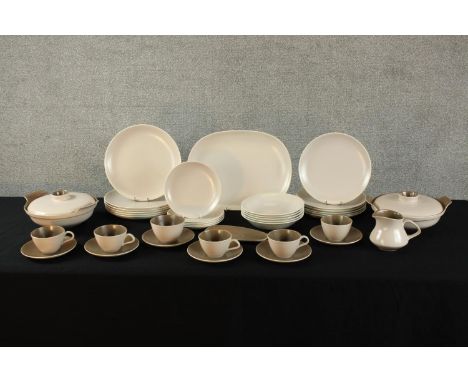 A 20th century Poole pottery brown twin tone six person part dinner set, marks verso. H.3 W.35 D.27cm Largest