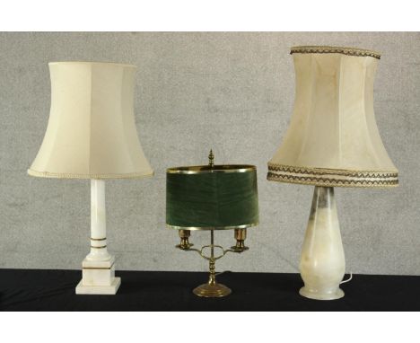 Three assorted table lamps comprised of a 20th century brass twin branch student lamp, an early 20th century grey hardstone b