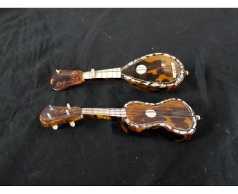 A 19th century tortoiseshell and bone miniature guitar and matching lute. H.3 W.14 D.4.5cm largest 