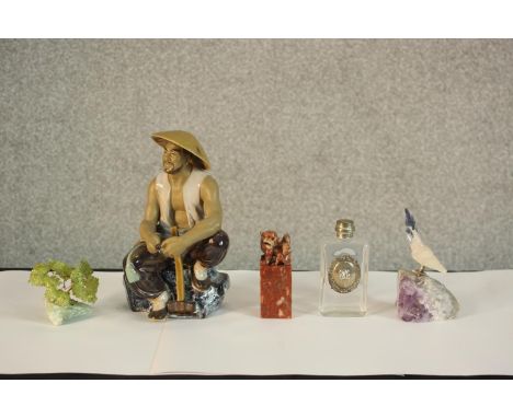 A 20th century Chinese porcelain figure of a seated man, together with a Chinese soapstone seal carved with Dog of Fo, a soda