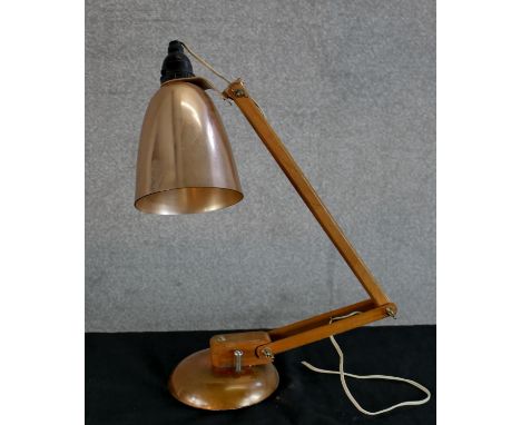 A mid 20th century copper effect angle poise lamp. H.42 W.40 D.13cm 