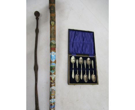 A souvenir badge walking stick, cased epns teaspoons and a vintage poker