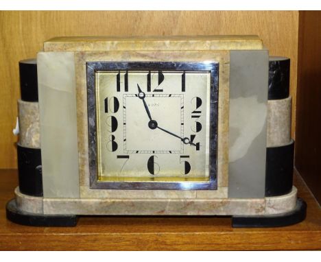 An Art Deco and onyx mantel clock with square dial and 8-day movement, 29cm wide, 18cm high. 