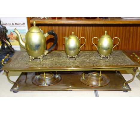 An early-20th century copper hot plate of rectangular form having two burners by Henry Loveridge &amp; Co, 66.5cm long (to ha