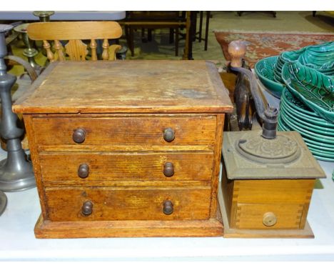 A set of brass postal scales with weights by John Heath, Birmingham, on wooden base, a small wooden nest of three drawers, 31