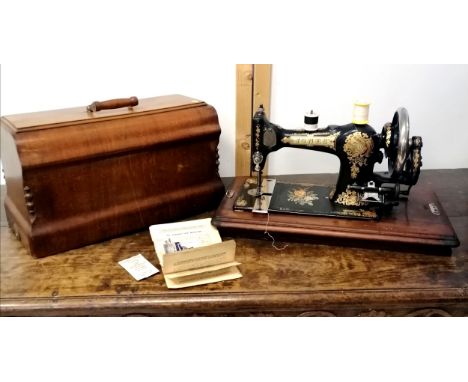 Antique walnut cased sewing machine by C S Jones Family, T Witcombe Chippenham, t/w it's original operating manual.