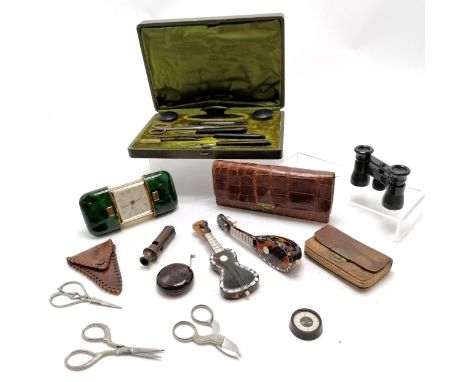 Boxed ebony manicure set, small opera glasses, Europa travelling alarm clock, 2 miniature musical instruments 13cm long, case