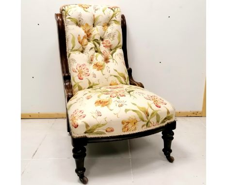 Antique mahogany framed button back nursing chair, on original castors, upholstered in Colefax &amp; Fowler Delft Tulips in r