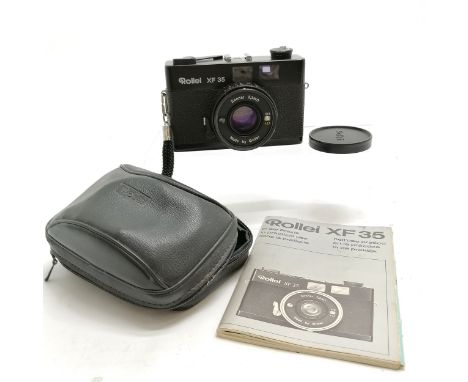 Rollei XF 35 camera has a Sonnar 2,3/40 lens in original case with booklet- shutter is working 