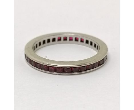 Unmarked white gold channel set ruby eternity ring - size L½ &amp; 2.3g total weight