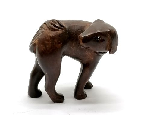 Carved wooden dog netsuke with bead eyes 3.5cm high- no obvious damage 