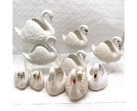 Collection of  Dartmouth pottery swans of varying sizes, Largest 29 cm high, 34 cm length (crack to wing) 5 medium size all h