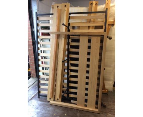 A light wood three quarter bed frame  