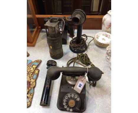 A Miners torch, three telephones and a Ships lamp